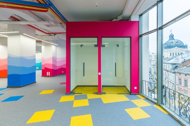 large office center in a modern style with colored walls unfurnished