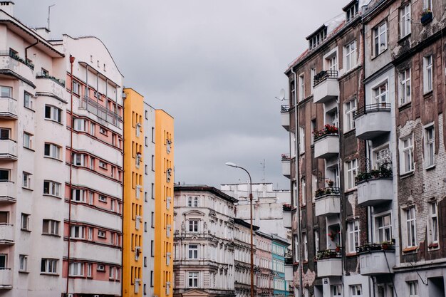 Large old house on a European street on a cloudy day.