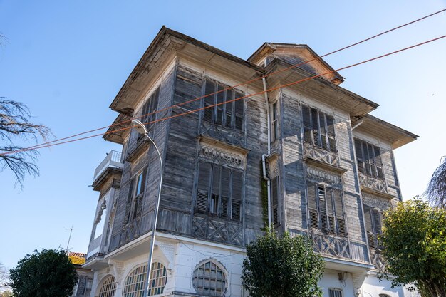 A large old house with a lot of windows and a slanted roof