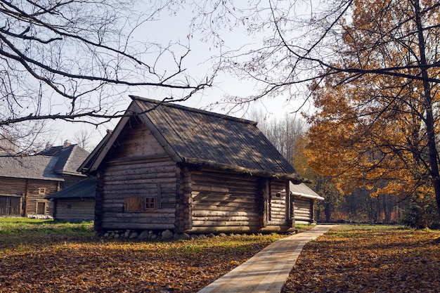 Large old log house in autumn in the village