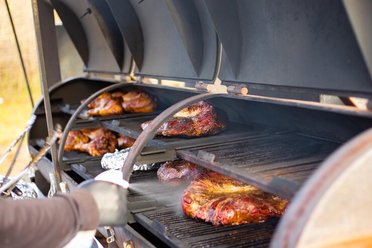 Photo a large piece of lamb tenderloin is baked on a professional grill cooking meat for a large company