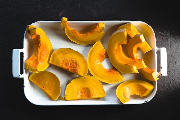 Large pieces of pumpkin in a baking dish