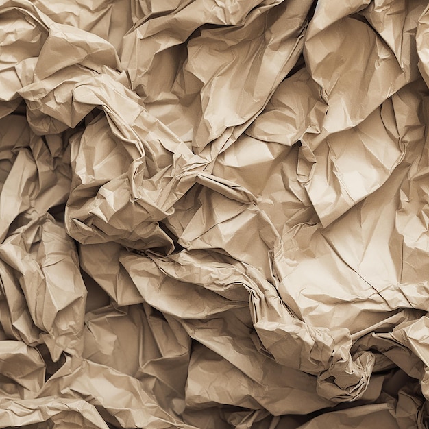 A large pile of crumpled brown paper with the word's on it