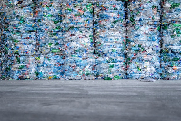 Large pile of plastic PET bottles compressed and ready for recycling