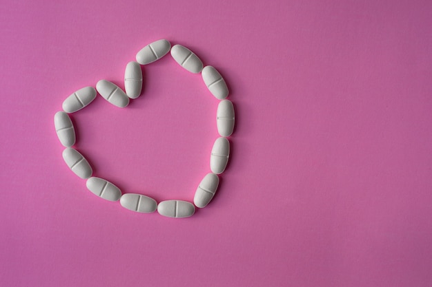 large pills or tablets, arranged in a heart shape