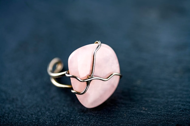 Large pink mineral on the ring Jewelry ring with stone