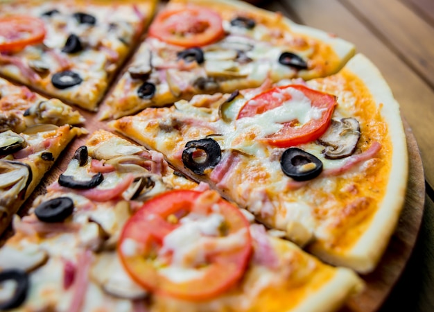 Large pizza on a wooden table. Restaurant.