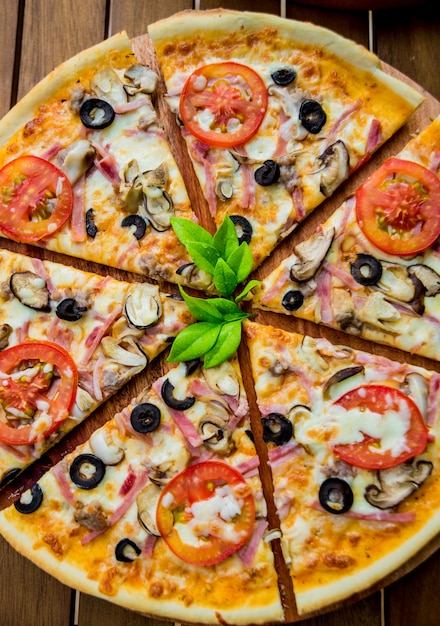 Large pizza on a wooden table. Restaurant.