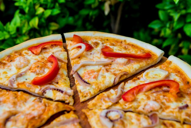 Large pizza on a wooden table. Restaurant.