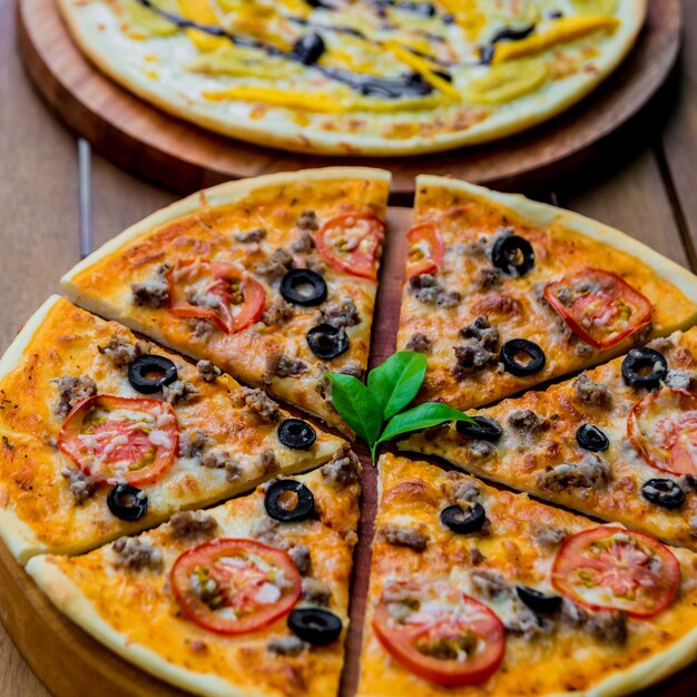 Large pizza on a wooden table. Restaurant.