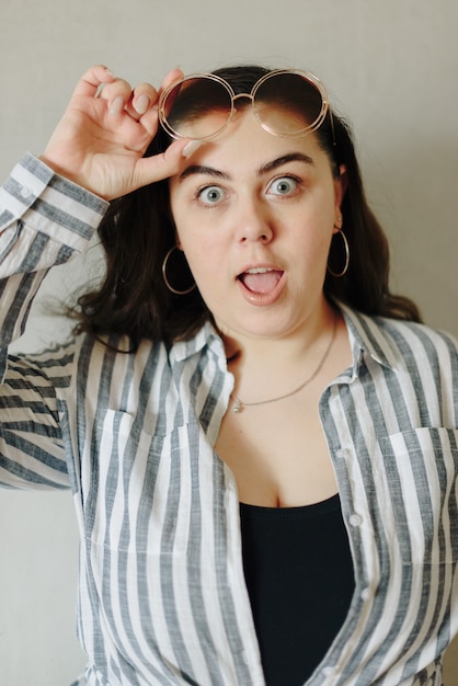 Large portrait of a beautiful surprised young woman