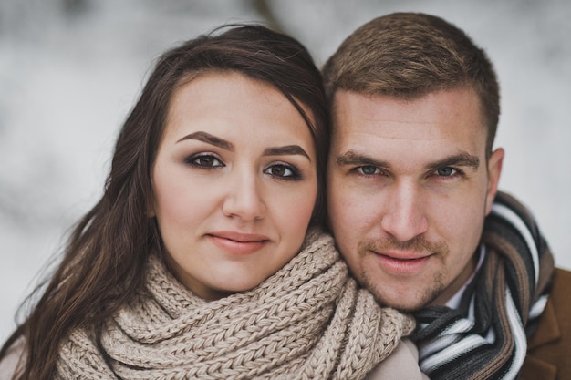 A large portrait of a man and a woman clinging to each others cheeks 889