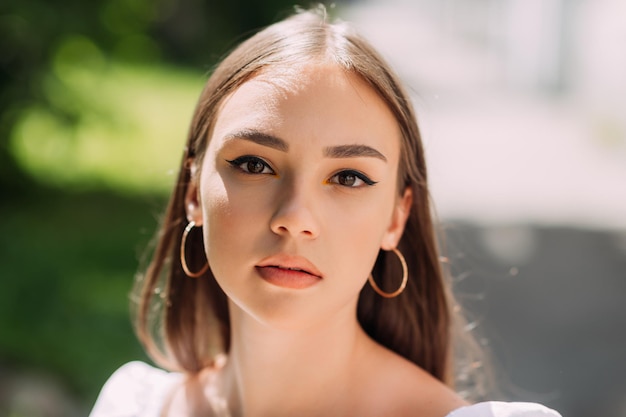 A large portrait of a young girl on a spring walk around the city 3622