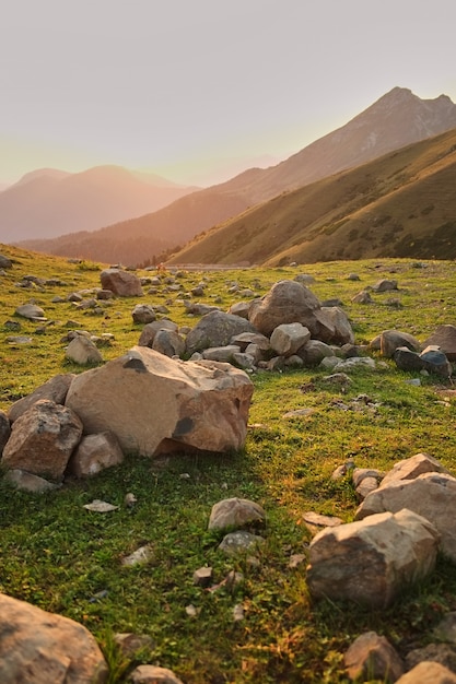 Large quartz rocks on a mountain meadow. sunset in the mountains.