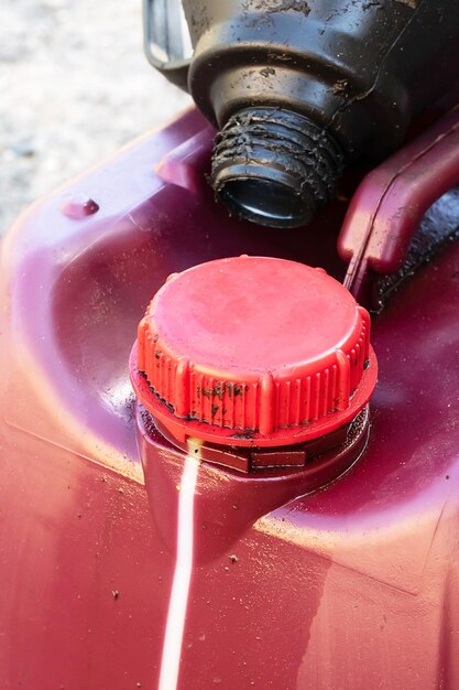 Large red canister of engine oil closeup