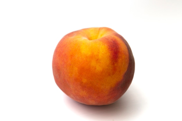 Large ripe peach isolated on a white