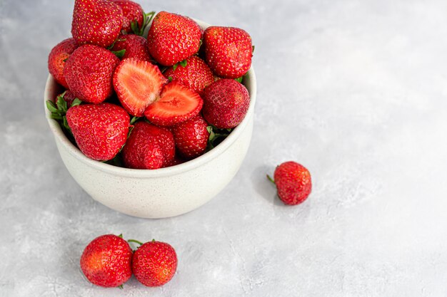 Large ripe strawberries are collected from the garden