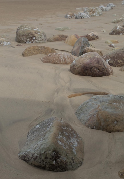 A large rock in the sand