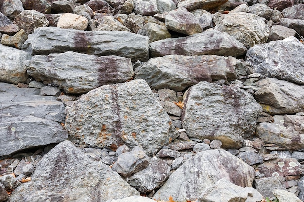 A large rock with a cross on it