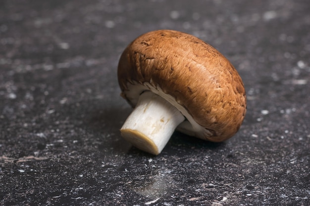 Large Royal champagne on a stone background. Vegetarian food. Artificially grown mushrooms.