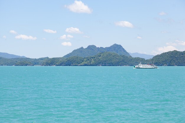 large ship crossing island