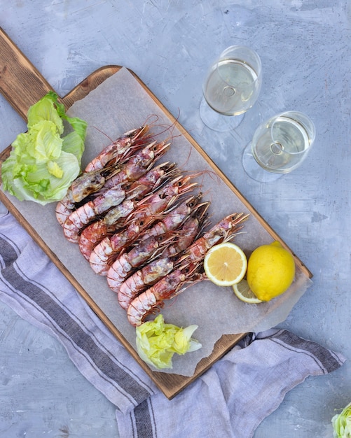 large shrimp on a wooden board