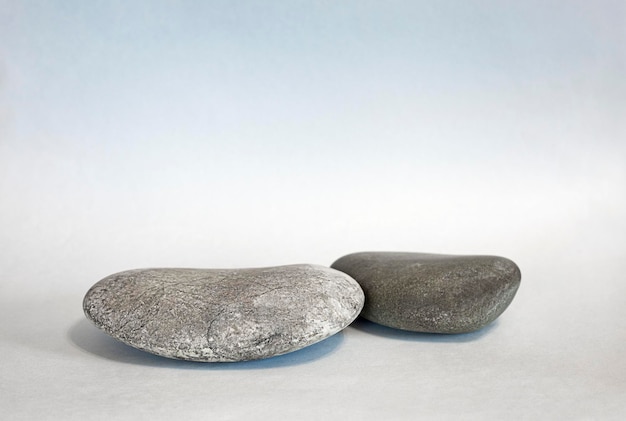 large stones lie on a gray-blue background