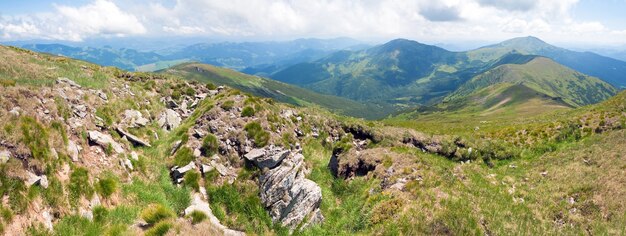 Large stones on summer mountainside (Ukraine, Carpathian Mountains). Three shots stitch image.