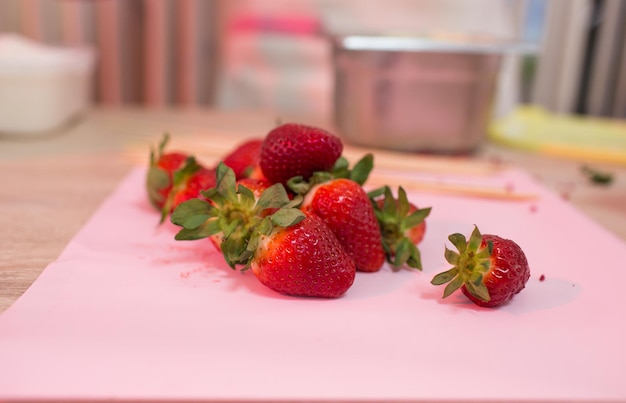 Large strawberries on a pink background. close-up