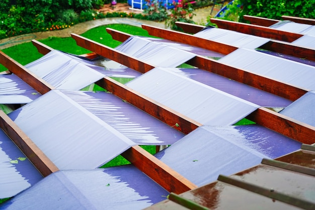 Large terrace roof with fabric panels and wooden beams for sun protection