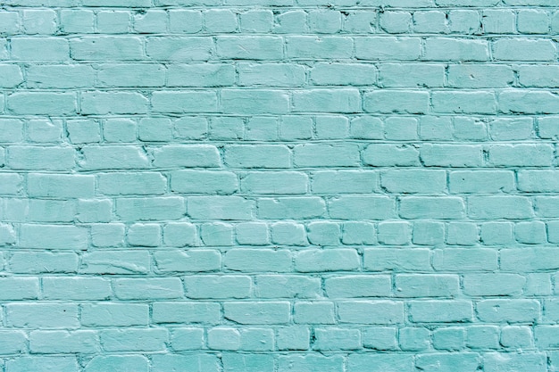 Large texture of light blue brick wall, textured surface. Brick background. blue brick wall