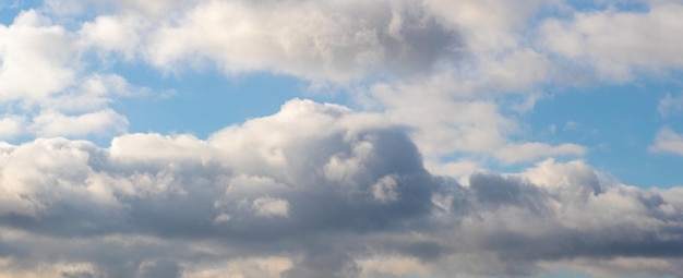 Large thick cumulus clouds in the blue sky