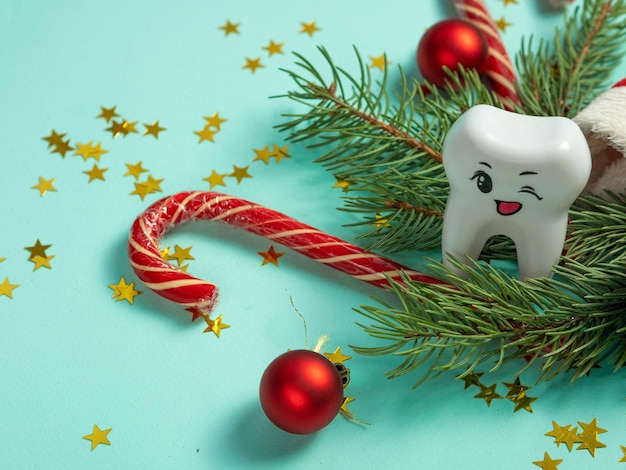 A large tooth with a groove winks on a Christmas background A place for your text