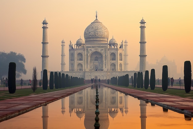 A large white building sits next to a pool of water creating a serene and picturesque scene Majestic Taj Mahal on a foggy morning AI Generated