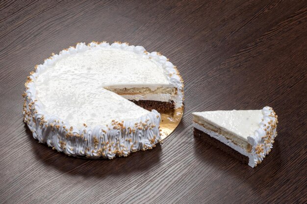 Large white cake with a piece cut off