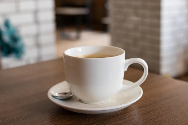 Large white mug with coffee close up