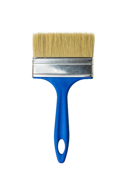 Large wide brush with blue handle isolated on white wall. Materials for painting.