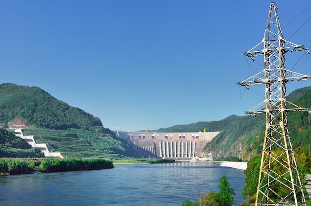 The largest hydroelectric power station on the mountain banks\
of the yenisei river, the coastal spillway. siberia, russia