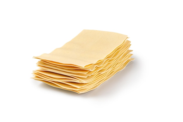 Lasagna sheets in stack Uncooked lasagna pasta isolated on white background Clipping path