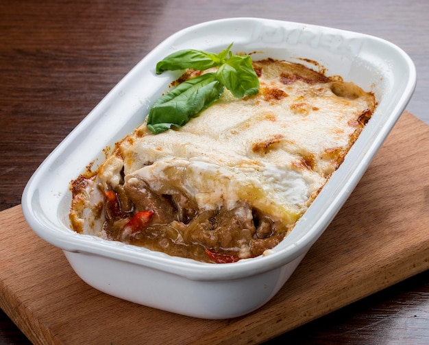 Lasagna with a rabbit in a ceramic bowl