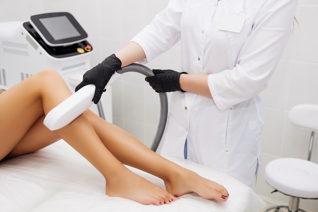 Laser epilation and cosmetology in beauty salon. Hair removal procedure. Laser epilation, cosmetology, spa, and hair removal 