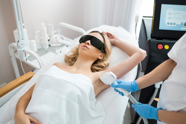 Laser epilation treatment at beauty clinic