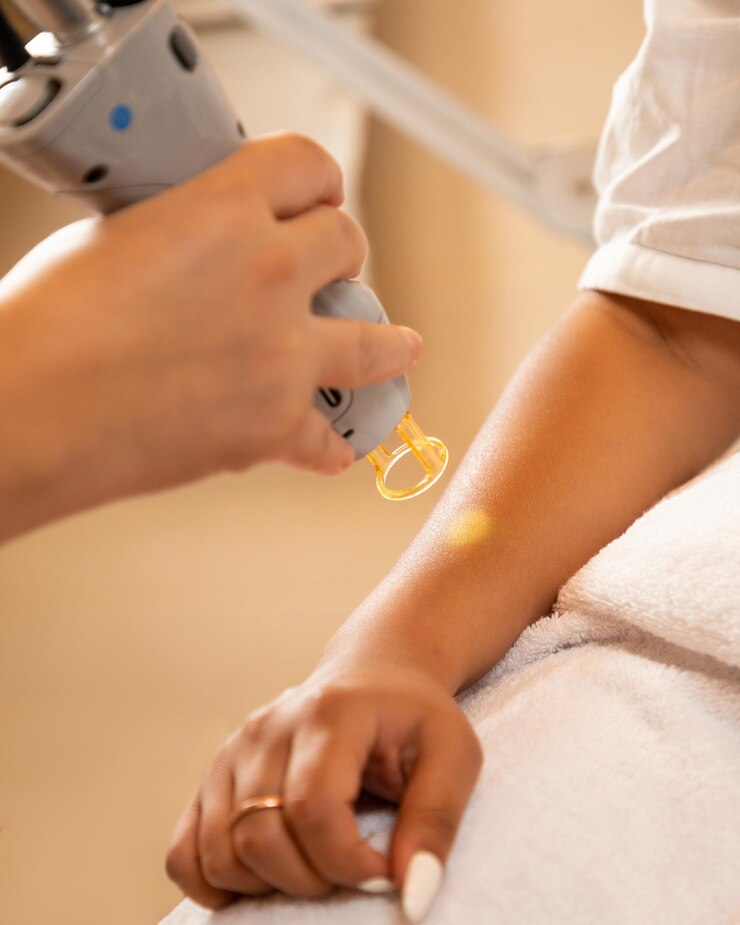 Laser hair removal in the beauty salon Woman having professional laser epilation procedure of arm