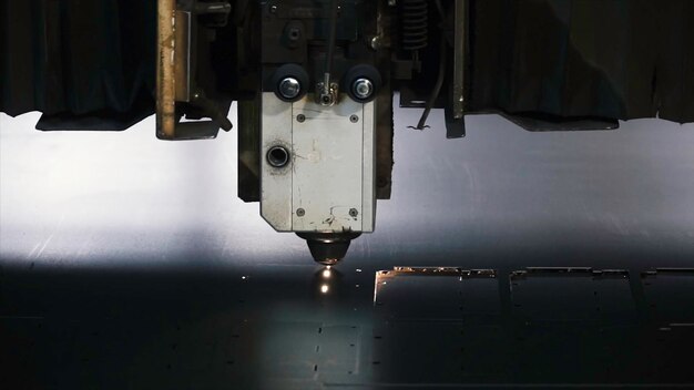 Laser machine cutting of sheet metal clip sparks fly from laser by automatic cutting cnc plc machine