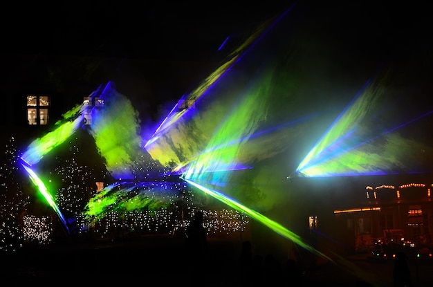 Laser show with blue green forms