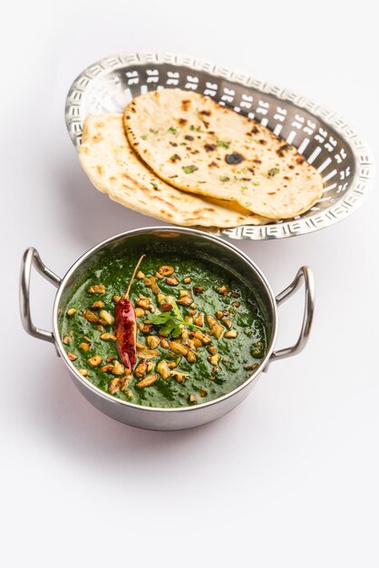 Lasooni palak recipe or dhaba style garlic spinach curry Indian main course served with naan