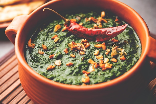 Lasooni palak recipe or dhaba style garlic spinach curry Indian main course served with naan