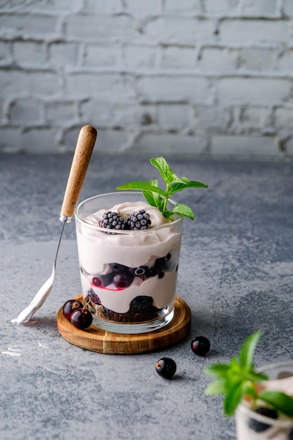 lassi is a milk drink, a milkshake with wild berries, on a white background