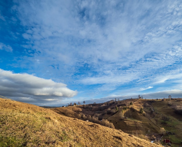 Last good weather days in autumn mountain countryside Peaceful picturesque Ukrainian Carpathians mountains scene