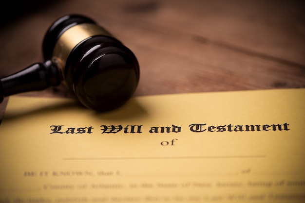 Last will and testament form with gavel. Decision, financial close up